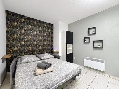 Un ou plusieurs lits dans un hébergement de l'établissement Cosy nid, terrasse & 2 parkings