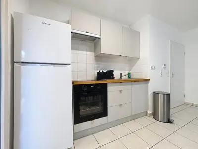 Cuisine ou kitchenette dans l'établissement Cosy nid, terrasse & 2 parkings