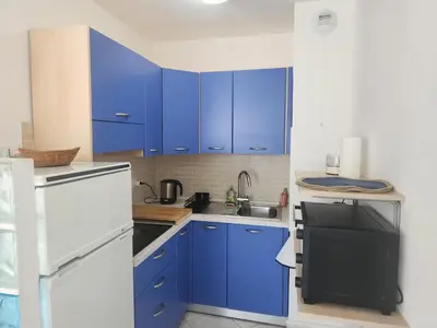 Cuisine ou kitchenette dans l'établissement Les Fleurs Bleues