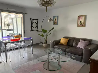 Coin salon dans l'établissement T3 Neuf-Plage 3mn parking privé
