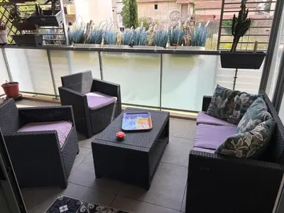 Coin salon dans l'établissement T3 Neuf-Plage 3mn parking privé