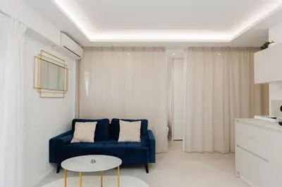 Coin salon dans l'établissement Elegant studio in Cap d'Antibes - Wifi - Clim et parking