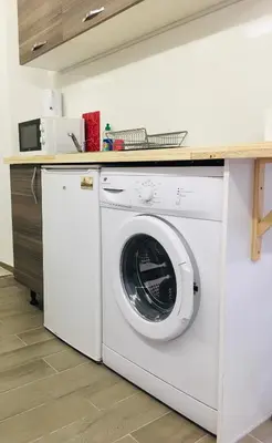 Cuisine ou kitchenette dans l'établissement Calmette