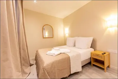 Un ou plusieurs lits dans un hébergement de l'établissement Hotel Villa Botanica