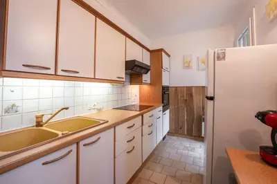 Cuisine ou kitchenette dans l'établissement Appartement calme au centre