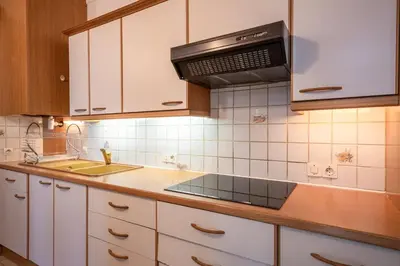 Cuisine ou kitchenette dans l'établissement Appartement calme au centre