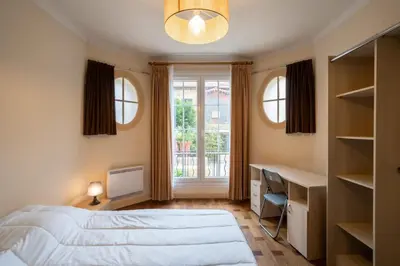 Un ou plusieurs lits dans un hébergement de l'établissement Appartement calme au centre