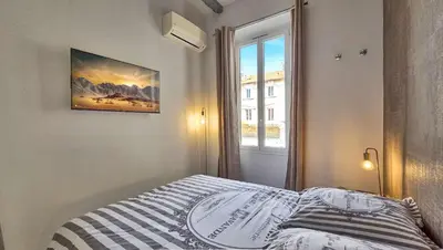 Un ou plusieurs lits dans un hébergement de l'établissement LX154 Loft rénové lumineux - plein centre Cannes