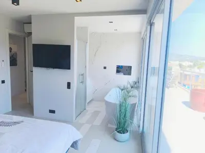 Télévision ou salle de divertissement dans l'établissement Appartement toit terrasse