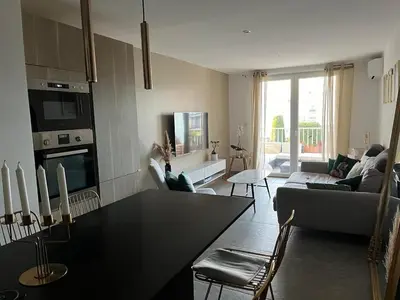 Cuisine ou kitchenette dans l'établissement Appartement 200m de la plage