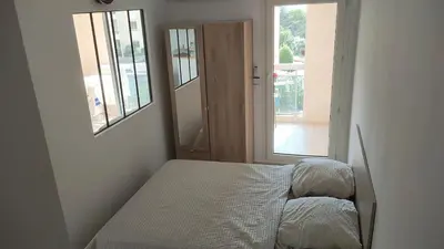 Un ou plusieurs lits dans un hébergement de l'établissement Apartment with residential pool