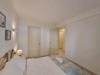 Un ou plusieurs lits dans un hébergement de l'établissement Ferrié Plage Palais Cannes
