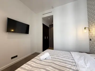 Un ou plusieurs lits dans un hébergement de l'établissement Carré d'Or - Luxueux - Vue mer