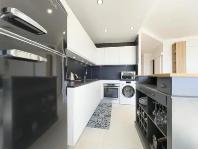 Cuisine ou kitchenette dans l'établissement Le KamS