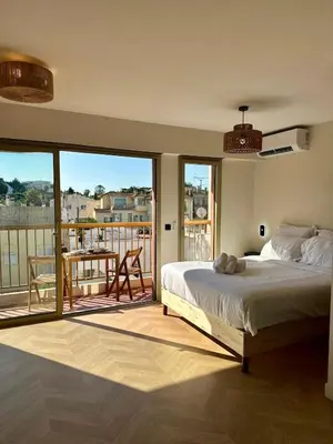 Un ou plusieurs lits dans un hébergement de l'établissement Studio lumineux 5 minutes Croisette et rue Antibes