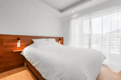 Un ou plusieurs lits dans un hébergement de l'établissement REF 2006 - Cannes Croisette - Luxurious apartment with sea view for rent
