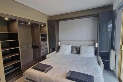 Un ou plusieurs lits dans un hébergement de l'établissement Apartment T2 Golfe Juan PANORAMIC SEA VIEW