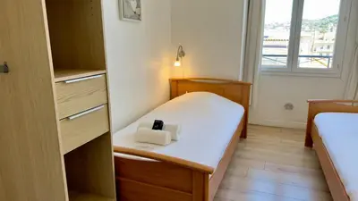 Un ou plusieurs lits dans un hébergement de l'établissement Scène & Palmiers - Cannes