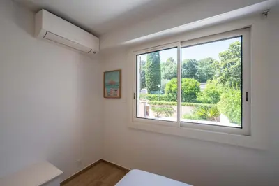 Un ou plusieurs lits dans un hébergement de l'établissement Charmante Maison dans une belle residence