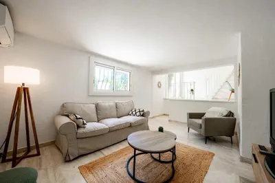 Coin salon dans l'établissement Charmante Maison dans une belle residence