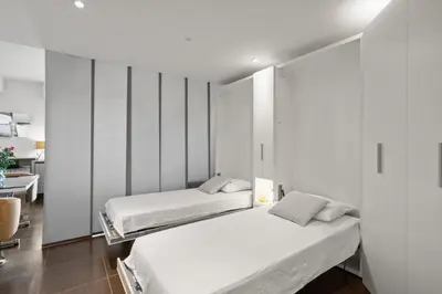 Un ou plusieurs lits dans un hébergement de l'établissement Agréable studio à deux pas de la Croisette