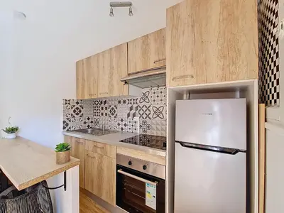 Cuisine ou kitchenette dans l'établissement Les Oiseaux