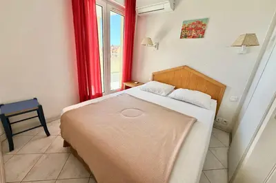 Un ou plusieurs lits dans un hébergement de l'établissement 1 bedroom apartment Golfe-Juan Sea view