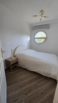 Un ou plusieurs lits dans un hébergement de l'établissement La Plage rooftop