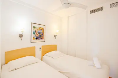 Un ou plusieurs lits dans un hébergement de l'établissement MISTRAL - Appartement 3 chambres, Piscine, Rooftop, Climatisation et Parking