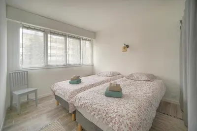 Un ou plusieurs lits dans un hébergement de l'établissement Calme 2 Chambres BALCON VUE JARDIN-CARNOT A2B266