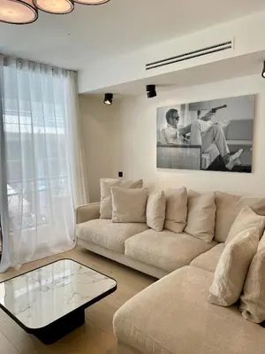 Coin salon dans l'établissement T2 chic et moderne à deux pas de la Croisette