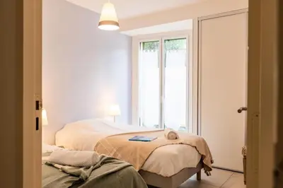 Un ou plusieurs lits dans un hébergement de l'établissement Résidence Rez-de-jardin Palm Beach, Piscine, Plages à Pied - Rez-de-jardin Palm Beach, piscine, plages à pied MAE-1753