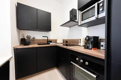 Cuisine ou kitchenette dans l'établissement Résidence Appartement Moderne En Plein Centre Ville ! - Appartement moderne en plein centre ville ! MAE-2463
