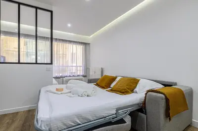 Un ou plusieurs lits dans un hébergement de l'établissement 8 MERLE T2 - Appartement moderner pour 4 personnes proche Palais