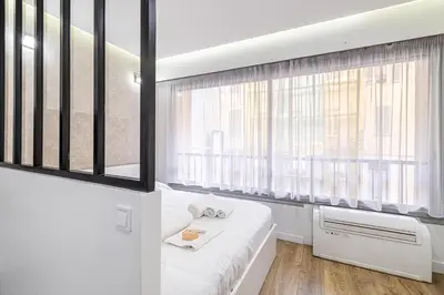 Un ou plusieurs lits dans un hébergement de l'établissement 8 MERLE T2 - Appartement moderner pour 4 personnes proche Palais