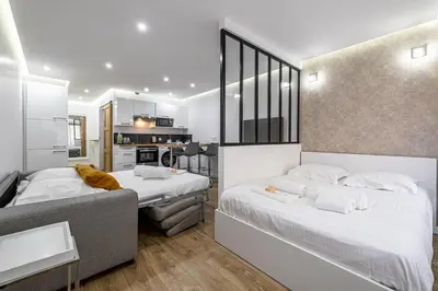 Un ou plusieurs lits dans un hébergement de l'établissement 8 MERLE T2 - Appartement moderner pour 4 personnes proche Palais