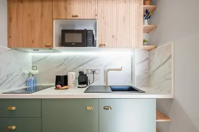 Cuisine ou kitchenette dans l'établissement Vue mer panoramique - Cocon cosy et luxe - Clim et Wifi
