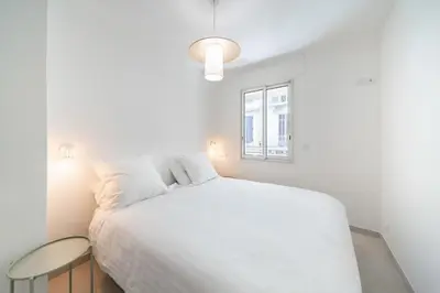 Un ou plusieurs lits dans un hébergement de l'établissement Chic appartement 2 pièces