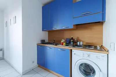 Cuisine ou kitchenette dans l'établissement Royal Park - Happy Rentals