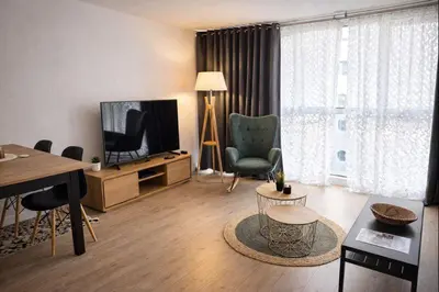 Télévision ou salle de divertissement dans l'établissement Le Palais de la Mer, T2, 4P, Plages et Centre