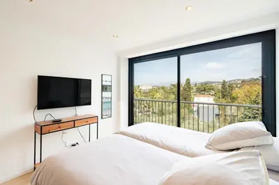 Un ou plusieurs lits dans un hébergement de l'établissement COZYSTAY - Appartement luxe 4P avec terrasse & vue mer à Cannes