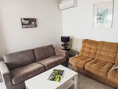 Coin salon dans l'établissement Apartment Les Jardins de l'Ermitage by Interhome