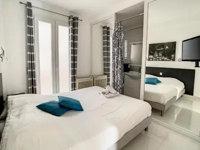 Un ou plusieurs lits dans un hébergement de l'établissement Luxueux appartements idéalement situés en plein centre ville de Cannes