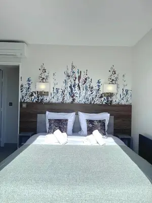 Un ou plusieurs lits dans un hébergement de l'établissement Penthouse vue mer avec Rooftop,Jacuzzi,et parking privé