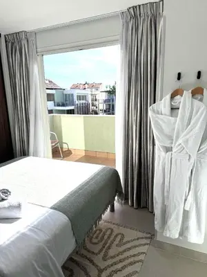 Un ou plusieurs lits dans un hébergement de l'établissement Penthouse vue mer avec Rooftop,Jacuzzi,et parking privé