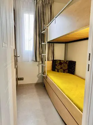 Un ou plusieurs lits dans un hébergement de l'établissement Penthouse vue mer avec Rooftop,Jacuzzi,et parking privé
