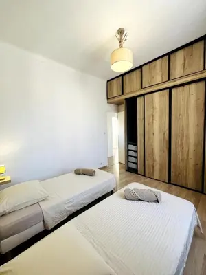 Un ou plusieurs lits dans un hébergement de l'établissement Appartement Calme Proche Plages