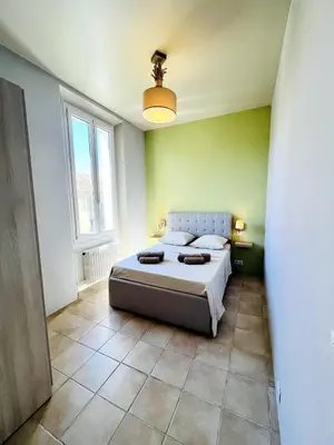 Un ou plusieurs lits dans un hébergement de l'établissement Appartement Calme Proche Plages