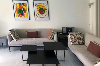 Coin salon dans l'établissement Appartement vue mer-piscine-3 pers-Cannes