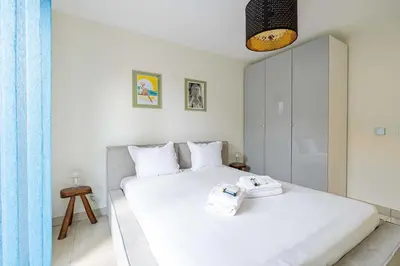 Un ou plusieurs lits dans un hébergement de l'établissement Spacious Apartment a c 1BR 4P – With Pool
